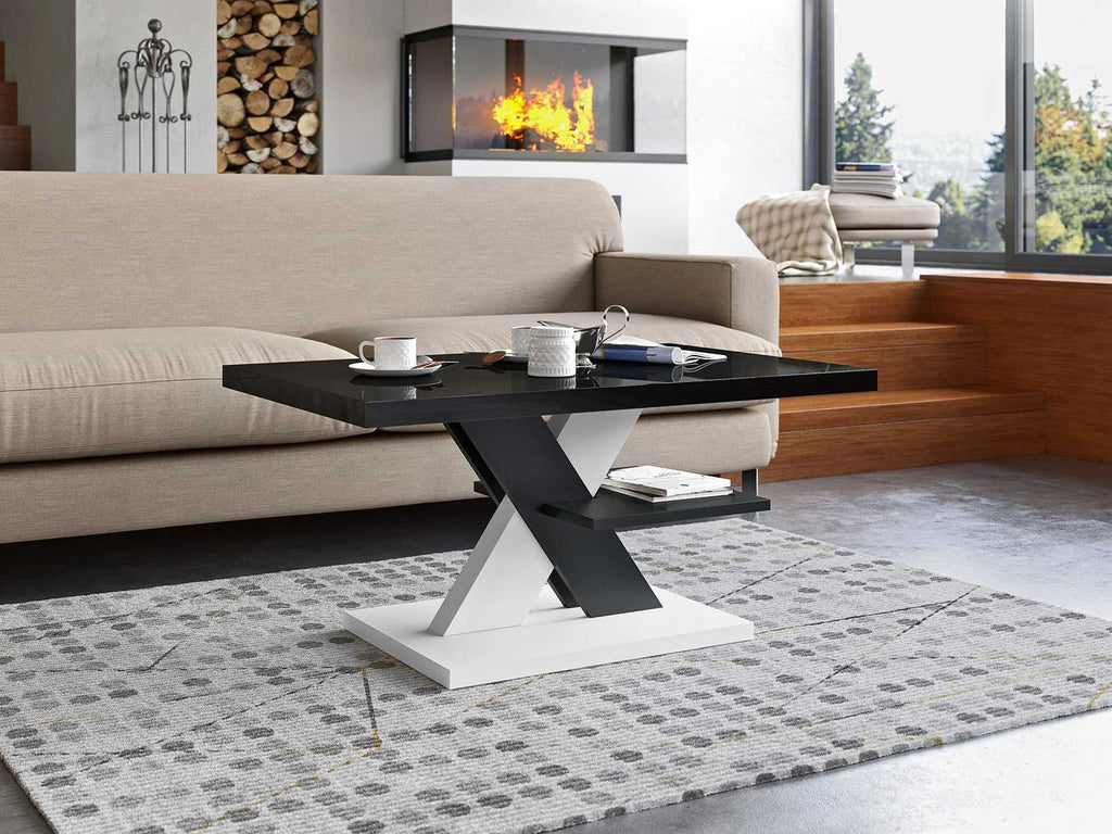 Contemporary coffee table featuring a high gloss black tabletop, modern design with black and white cross legs, and a sleek white table foot. Stylish living room furniture, glossy surface, minimalist decor, and monochrome color scheme