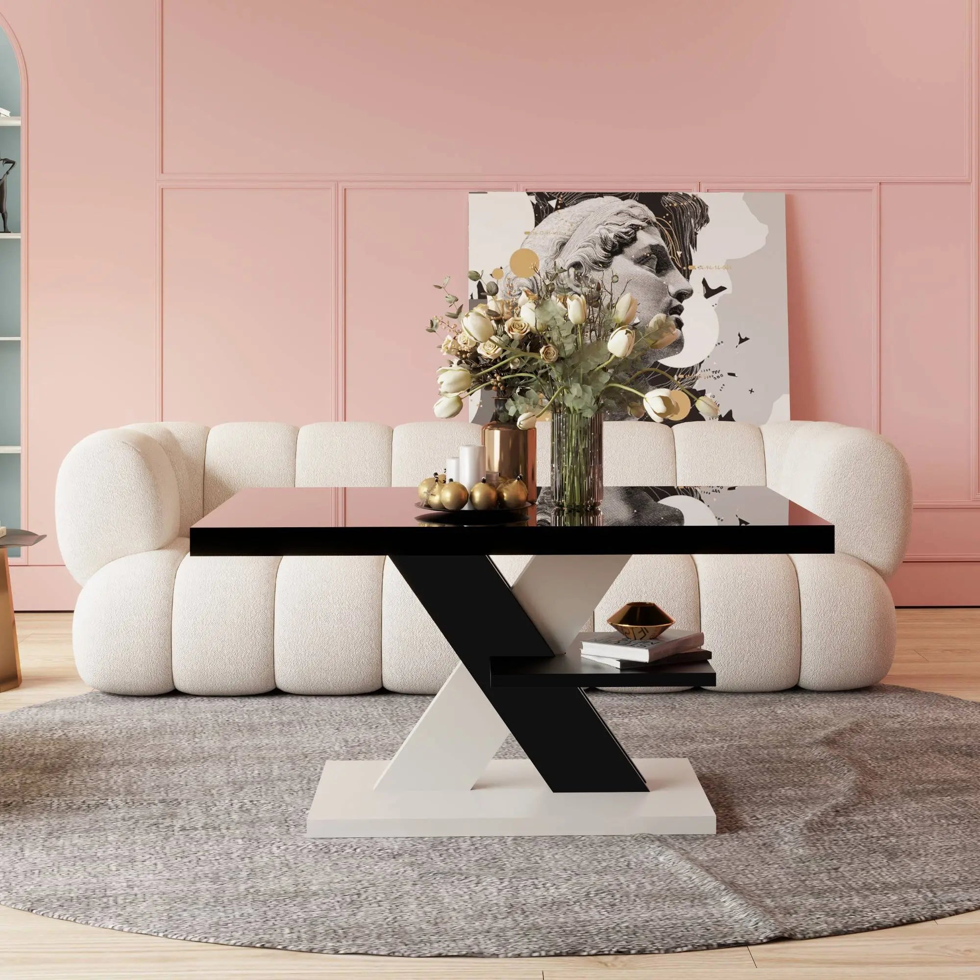 A glossy black coffee table with a white base and bold design, styled in a pink and gold-accented luxurious living room.